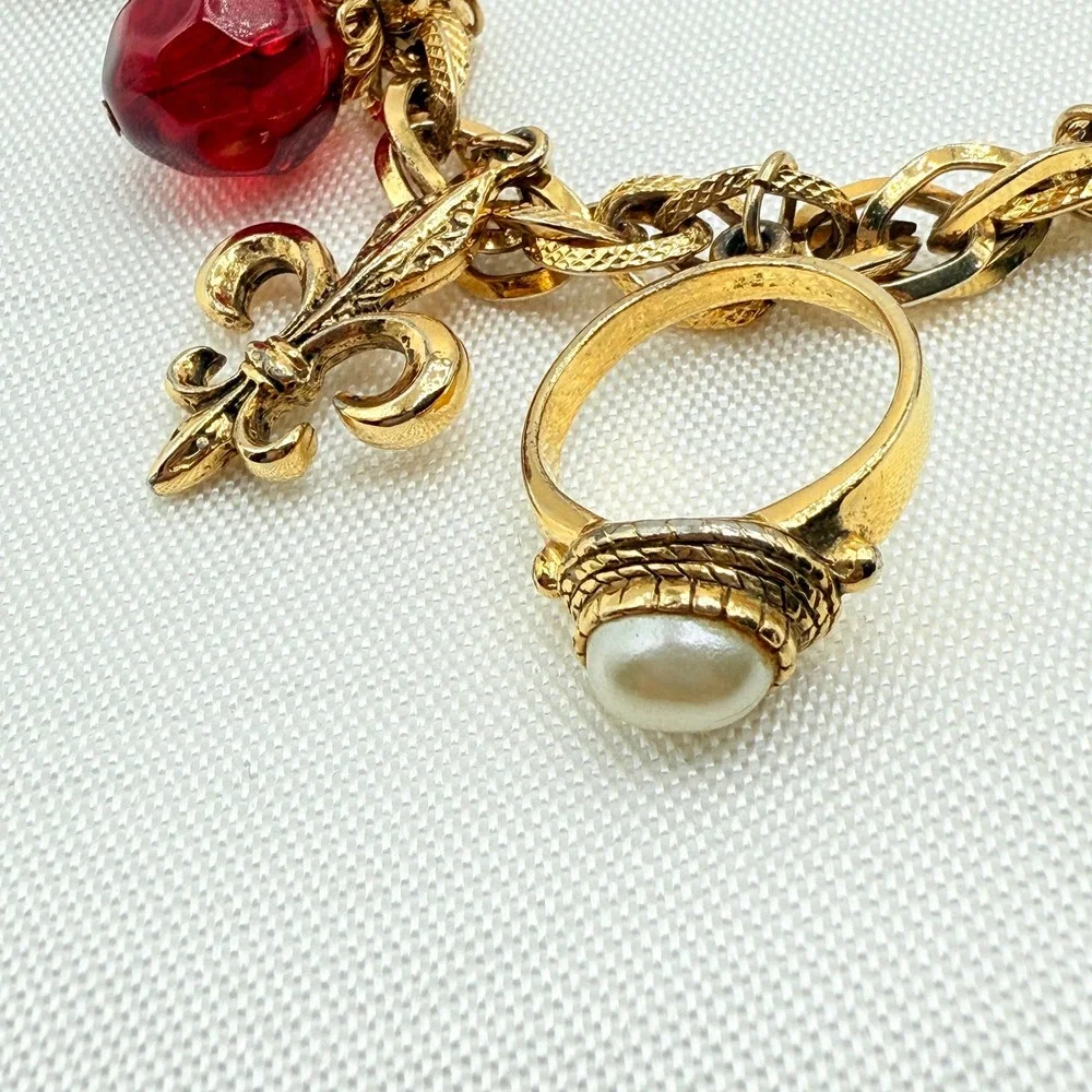 Vintage Gold Tone Charm Bracelet w/ Fleur de Lis, Ring, and Faceted Glass Beads